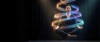 Young Asian woman levitating in lotus pose, surrounded by glowing spiral light trails on dark background, evoking mindfulness and spiritual energy.