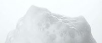 Frozen mountain peak covered in thick snow and ice crystals, isolated on white background, suitable for winter sports, outdoor adventure, and nature design projects.