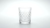 Crystal cut glass tumbler with diamond pattern design isolated on white background for luxury drinkware and elegant dining concepts.