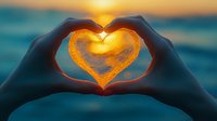 Silhouetted hands forming heart shape against vibrant orange sunset over ocean, capturing glowing sun within heart gesture, creating romantic beach atmosphere.