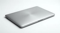 Closed silver laptop on white background, suitable for technology, business, and computing concepts.