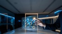 Businessman touching futuristic holographic interface with digital icons in modern office environment showcasing advanced technology and innovation concepts.