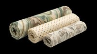 Rolled fabric swatches with various patterns including floral, dotted, and botanical designs isolated on transparent background. Ready for textile design, print-on-demand products, and digital crafts.