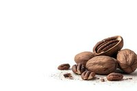Mixed coffee beans and pecan nuts scattered on white surface with ground coffee powder, isolated composition with copy space for food design and marketing.