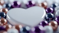 White heart shape surrounded by shiny metallic beads in purple, rose gold, navy and pearl colors creating romantic bokeh effect for valentines and love concepts.