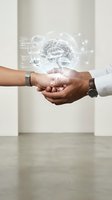 Two people holding hands with a glowing holographic brain floating above, symbolizing AI collaboration, neuroscience, and digital health innovation.