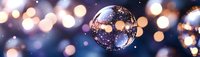 Crystal glass sphere reflecting colorful bokeh lights against dark background, creating magical atmosphere for festive or spiritual concepts.