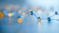 Glowing glass spheres connected by thin lines against blurred blue background with golden bokeh lights create futuristic network visualization concept.