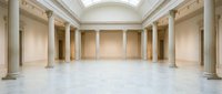 Empty neoclassical museum gallery interior with marble columns, ornate ceiling, and polished floors for exhibitions and cultural displays.