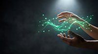 Hands creating magical green energy flow with glowing particles and light effects on dark background for digital technology and innovation concepts.