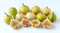 Fresh figs whole and halved showing pink flesh and seeds, isolated on white background for food styling, culinary, and recipe design use.