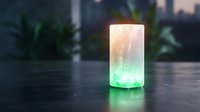 Glowing cylindrical salt lamp emits soothing green and warm white light on dark surface, creating peaceful ambiance for meditation and relaxation spaces.