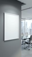 Modern office interior with blank white frame on gray wall and conference room with city view for corporate presentation and business meeting space.