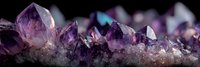 Purple amethyst crystal cluster formation with natural geometric facets and translucent surfaces creating mystical healing energy display for wellness decor.