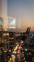 Modern office workspace with computer monitors displaying financial charts and data analytics during sunset, overlooking illuminated cityscape for business, finance, trading, and corporate concepts.
