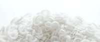 White basmati rice grains scattered on clean background for cooking and food preparation projects.