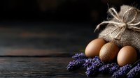 Farm fresh brown eggs in rustic burlap sack with dried lavender flowers on dark wooden table. Organic countryside breakfast ingredients concept.