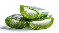 Fresh aloe vera plant slices showing transparent gel and green flesh on white background, natural organic skincare ingredient for cosmetics and medicine.