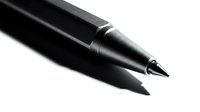 Black ballpoint pen close-up on white background isolated for business writing office supplies stationery design elements commercial use.
