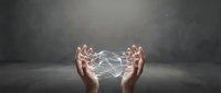 Hands cupping glowing network connections with light beams creating digital web pattern against dark background for technology and innovation concepts.