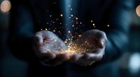 Magical glowing golden sparkles and light particles floating above cupped hands against dark background, creating mystical atmosphere for spiritual concepts.