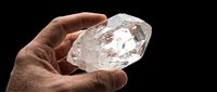 Isolated hand holding raw diamond crystal on transparent background, ready for design use on t-shirts, clipart, stickers, print-on-demand products and sublimation projects.