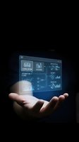 Futuristic smart home control panel floating above open palm showing automation interface with living room and kitchen icons on dark background.