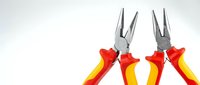 Two insulated long-nose pliers with red and yellow handles on a light background, essential tools for electrical work and home repair.