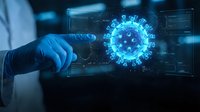 Medical professional in blue gloves pointing at holographic virus model on digital interface for healthcare technology research and pandemic analysis.