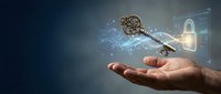Antique bronze key floating above open palm with digital security interface and glowing particles on dark blue background for cybersecurity concepts.