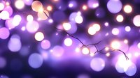 Glowing string lights creating magical purple and pink bokeh effect against dark background, festive illumination with soft defocused circles of light.