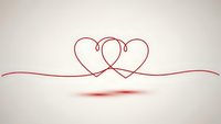 Two intertwined hearts drawn with elegant red line art creating romantic symbol for love, wedding, Valentine's Day, anniversary celebrations and relationships.