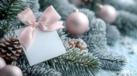 Elegant white gift box with soft pink ribbon bow nestled among frosted evergreen branches with rose gold ornaments and pinecones for holiday celebrations.