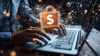 Digital security lock with dollar symbol over laptop keyboard, glowing particles effect and hands typing, representing financial technology and cybersecurity concept.