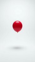 Single red balloon floating with white string on clean white background for party celebration and festive decoration concepts.