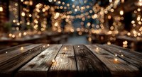 Empty wooden table with warm bokeh lights background for product display and holiday decorations.