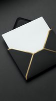 Elegant black envelope with gold foil edges and blank white card for luxury invitations, wedding stationery, and premium correspondence design.