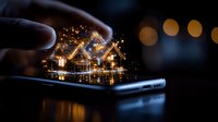 Glowing miniature house emerging from smartphone screen with magical sparkles and bokeh lights, creating dreamy night atmosphere for real estate concept.