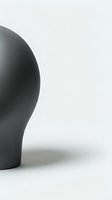 Minimalist black sculptural form with organic curves against neutral background, suitable for contemporary design and artistic projects.