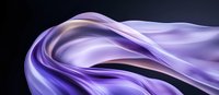 Smooth flowing purple and lavender silk fabric waves creating elegant curves and folds against dark background, soft luxurious textile in motion.