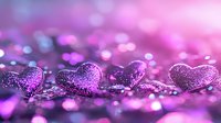 Glittering purple hearts with sparkles on blurred bokeh background in pink and violet colors, romantic valentines day concept for greeting cards.