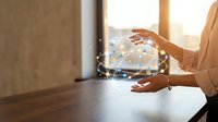 Professional businesswoman hands creating digital holographic globe with network connections in modern office environment for technology presentations.