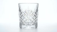 Crystal cut glass tumbler with diamond pattern design isolated on white background for luxury drinkware and barware collections.