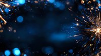Glowing sparkler with golden light trails and blue bokeh effects against dark background creates magical festive atmosphere for holiday designs.