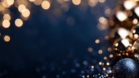 Festive Christmas ornament with blue and gold bokeh lights creating magical holiday atmosphere against dark background. Decorative seasonal composition.