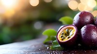 Fresh passion fruits with water drops on dark surface against blurred bokeh background, ripe purple maracuya cut in half showing seeds and pulp.