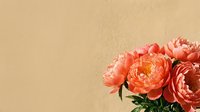 Lush coral peony bouquet against a warm beige textured wall, soft natural light, elegant floral arrangement for wedding or home decor.