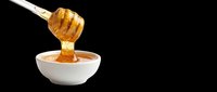 Honey dipper dripping golden honey into a white bowl, isolated on transparent background, ready for food packaging, stickers, print on demand, and T-shirt design use.