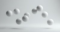 White golf balls floating in mid-air against clean gray background for sports equipment advertising and recreational activity promotions.