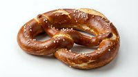 Freshly baked pretzel with coarse salt crystals on white background, isolated for food packaging, menus, bakery designs and culinary content.
